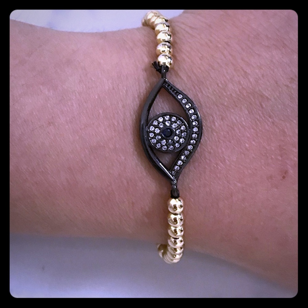Eye gold tone bead bracelet